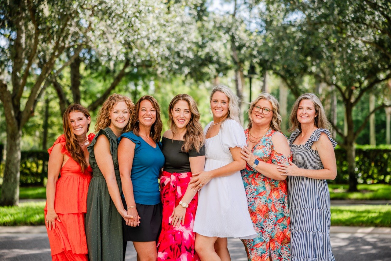 friends gathered together at a Restore Collective table